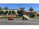 Community clubhouse with parking and golf cart at 7750 E Broadway Rd # 911, Mesa, AZ 85208