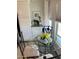 Small dining area with round glass table and iron chairs, near window at 7750 E Broadway Rd # 911, Mesa, AZ 85208