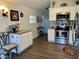 White cabinets, granite countertops, stainless steel appliances, and kitchen island at 7750 E Broadway Rd # 911, Mesa, AZ 85208