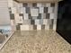 Kitchen featuring granite countertops and gray backsplash at 7750 E Broadway Rd # 911, Mesa, AZ 85208