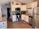 Modern kitchen featuring stainless steel appliances and granite countertops at 7750 E Broadway Rd # 911, Mesa, AZ 85208