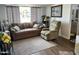 Inviting living room with a couch and recliner near the bathroom at 7750 E Broadway Rd # 911, Mesa, AZ 85208