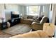 Relaxing living room with comfy seating and a large TV at 7750 E Broadway Rd # 911, Mesa, AZ 85208