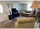 Bright living room featuring comfy seating and a large TV at 7750 E Broadway Rd # 911, Mesa, AZ 85208