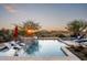 Spacious pool with sunset views and lounge chairs at 9277 E Happy Hollow Dr, Scottsdale, AZ 85262