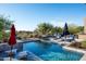 Inviting swimming pool with ample lounge chairs at 9277 E Happy Hollow Dr, Scottsdale, AZ 85262