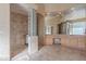 Large bathroom with double sinks, shower, and glass block windows at 11917 E Mariposa Grande Dr, Scottsdale, AZ 85255