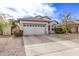 Single-story house with a two-car garage and desert landscaping at 11929 W Madison St, Avondale, AZ 85323