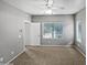 Bedroom with carpet, ceiling fan, windows, and neutral decor at 1351 N Pleasant Dr # 2079, Chandler, AZ 85225