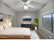 Cozy bedroom with ceiling fan, sliding mirror closet doors, and large window at 1351 N Pleasant Dr # 2079, Chandler, AZ 85225