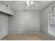 Empty bedroom featuring carpet, a ceiling fan, and neutral-colored walls at 1351 N Pleasant Dr # 2079, Chandler, AZ 85225
