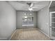 A bedroom with carpeted floors, a ceiling fan, and neutral-colored walls at 1351 N Pleasant Dr # 2079, Chandler, AZ 85225