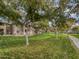 Lush green community grounds with paved walkways and mature trees at 1351 N Pleasant Dr # 2079, Chandler, AZ 85225
