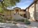 Inviting stucco exterior with shaded walkway and desert landscaping at 1351 N Pleasant Dr # 2079, Chandler, AZ 85225
