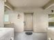 View of the front door, with stucco exterior and an inviting entrance at 1351 N Pleasant Dr # 2079, Chandler, AZ 85225