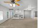 Living area with built-in shelving, carpeted floors, and neutral walls at 1351 N Pleasant Dr # 2079, Chandler, AZ 85225
