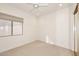 Well-lit bedroom with ceiling fan and carpet flooring at 13631 E Windrose Dr, Scottsdale, AZ 85259