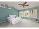 Bright bedroom with bay window and ceiling fan at 14105 W Sky Hawk Dr, Sun City West, AZ 85375