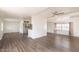 Living room with wood-look flooring and several large windows with blinds at 151 S 39Th St, Mesa, AZ 85206