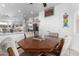 Dining area adjacent to the kitchen with an octagon table and four chairs at 16021 W Sentinel Dr, Sun City West, AZ 85375