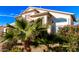 Two-story house with lush landscaping and palm trees at 16080 W Maricopa St, Goodyear, AZ 85338