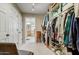 Spacious closet with shelving, hanging rods and bathroom access at 18501 E Avenida Del Ray --, Rio Verde, AZ 85263