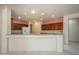 Kitchen with granite countertops and dark wood cabinets at 20229 N Sundance Way, Surprise, AZ 85374