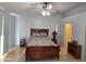 Bright bedroom with wood flooring, double bed, and ceiling fan at 2101 S Meridian Rd # 421, Apache Junction, AZ 85120