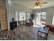 Living room with hardwood floors, bay window, and patio access at 2101 S Meridian Rd # 421, Apache Junction, AZ 85120
