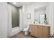 Modern bathroom with gray tile shower and wood vanity at 2119 E Jennifer Lynn Way, Phoenix, AZ 85022