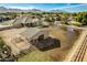 Fenced paddock and shelter with the nearby mountains in the distance at 21406 E Mewes N Rd, Queen Creek, AZ 85142