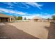 Spacious backyard with a horse barn and a white fence at 21406 E Mewes N Rd, Queen Creek, AZ 85142