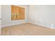 Bright bedroom with wood-look flooring and window with shutters at 21406 E Mewes N Rd, Queen Creek, AZ 85142