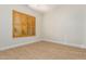 Empty bedroom with wood-look flooring and plantation shutters at 21406 E Mewes N Rd, Queen Creek, AZ 85142