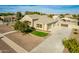 Aerial view of a home with a driveway, landscaped yard, a three-car garage, and a fenced backyard at 21406 E Mewes N Rd, Queen Creek, AZ 85142
