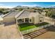 Backyard of home featuring grassy areas, white fencing, and tiled roofing at 21406 E Mewes N Rd, Queen Creek, AZ 85142