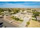 Aerial view of a home with a pond, landscaping, a three-car garage, and RV gate at 21406 E Mewes N Rd, Queen Creek, AZ 85142