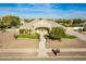 Elevated view of a single-story home with a landscaped front yard, an arched entryway, and stone accents at 21406 E Mewes N Rd, Queen Creek, AZ 85142