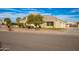Street view of a single-Gathering home with a three-car garage, landscaping, and a fenced backyard at 21406 E Mewes N Rd, Queen Creek, AZ 85142