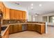 Spacious kitchen featuring wood cabinets, stainless steel appliances, and tile backsplash at 21406 E Mewes N Rd, Queen Creek, AZ 85142