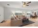 Open concept living room with adjacent dining area at 21643 N 29Th Dr, Phoenix, AZ 85027