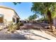 Landscaped backyard with curved concrete pathway at 2191 E Bellerive Pl, Chandler, AZ 85249