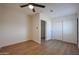 Spacious bedroom with double door closet and ceiling fan at 2224 N 24Th Pl, Phoenix, AZ 85008