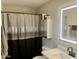 Clean bathroom with a lighted vanity mirror and modern fixtures at 2257 W Roeser Rd, Phoenix, AZ 85041