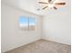 Well-lit bedroom with a window offering an exterior view at 2316 S 66Th Ln, Phoenix, AZ 85043