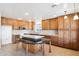 Spacious kitchen featuring an island and wood cabinets at 2316 S 66Th Ln, Phoenix, AZ 85043