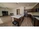 Modern kitchen with island, stainless steel appliances and view into Gathering room at 23451 S 228Th St, Queen Creek, AZ 85142