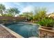 Spacious rectangular pool with brick coping and landscaping at 25410 N 46Th Ln, Phoenix, AZ 85083