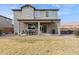 Two-story home with covered patio and grassy yard at 2924 N Taylor Ln, Casa Grande, AZ 85122