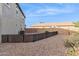 Small backyard with gravel and wooden fence at 2924 N Taylor Ln, Casa Grande, AZ 85122